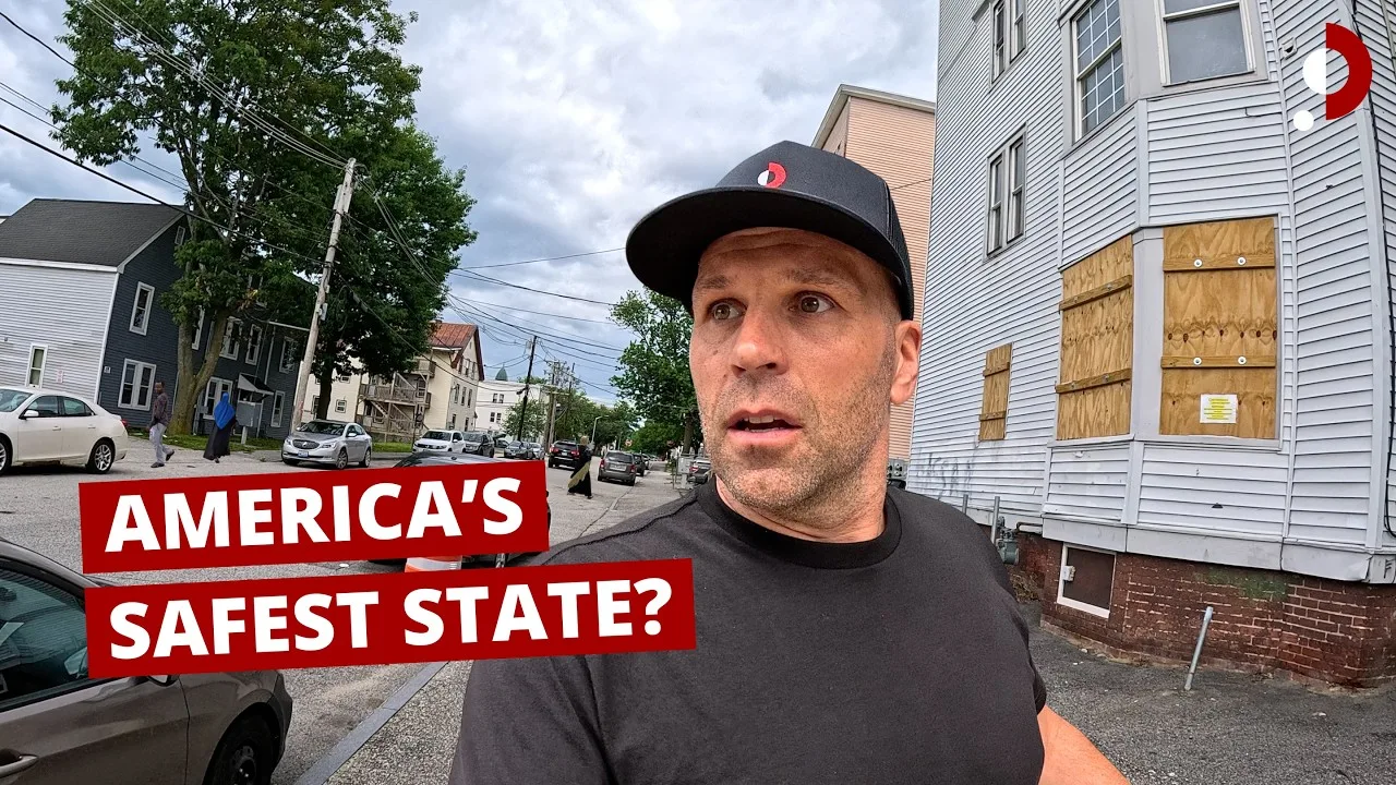 Peter Santenello on-camera interviewing a subject on a residential street, an example of solo filmed documentary work