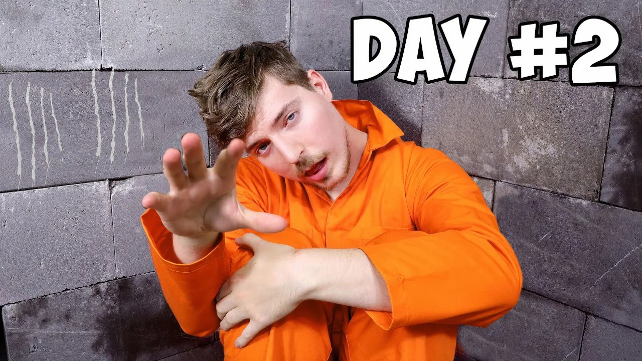 MrBeast video thumbnail for 'I Spent 50 Hours In Solitary Confinement,' showing the creator inside a bare confinement cell